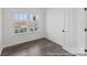 Versatile room with hardwood flooring and abundant natural light from large windows at 9913 Jack Nicklaus Dr # 908, Lancaster, SC 29720