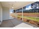 Spacious screened porch offering views of the serene backyard and beautiful tree line at 9913 Jack Nicklaus Dr # 908, Lancaster, SC 29720