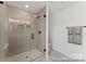 Modern glass shower featuring tiled walls, recessed lighting, and sleek black hardware at 9913 Jack Nicklaus Dr # 908, Lancaster, SC 29720