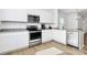 Well-equipped kitchen with stainless steel appliances, white cabinets, and stylish countertops at 10031 Travis Floyd Ln, Charlotte, NC 28214