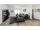Bright living room with hardwood floors, large windows, and stylish furnishings at 10031 Travis Floyd Ln, Charlotte, NC 28214