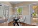 Sunlit breakfast area with hardwood floors, white wainscoting, and backyard views at 101 Blueberry Hill Dr, Statesville, NC 28625