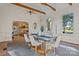 Sun-filled dining room with hardwood floors, wood beams, and views to the kitchen at 101 Blueberry Hill Dr, Statesville, NC 28625
