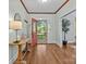 Bright foyer with hardwood floors, a decorative table and an open view of the front yard at 101 Blueberry Hill Dr, Statesville, NC 28625