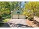 Detached two car garage with basketball hoop and mature landscaping at 101 Blueberry Hill Dr, Statesville, NC 28625