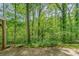 This home features a lush, wooded backyard, that offers privacy at 102 Forest Ct, Huntersville, NC 28078