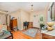 Entryway featuring hardwood floors and a white front door, with furniture and personal items adding a lived-in feel at 102 Forest Ct, Huntersville, NC 28078