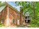 The exterior of this home has a classic brick facade and lots of windows at 102 Forest Ct, Huntersville, NC 28078