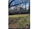 A charming single-story home with a classic brick exterior, nestled amongst bare winter trees at 102 Forest Ct, Huntersville, NC 28078