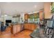 Charming kitchen area with hardwood flooring, wood cabinets, stainless steel appliances, and granite countertops at 102 Forest Ct, Huntersville, NC 28078
