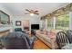 Inviting living room with a fireplace, hardwood floors, and large windows, offering a comfortable and bright space at 102 Forest Ct, Huntersville, NC 28078