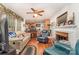 Cozy living room with a fireplace, hardwood floors, and open access to the kitchen, perfect for entertaining at 102 Forest Ct, Huntersville, NC 28078