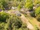 A quiet home nestled in a lush neighborhood, featuring mature trees and private surroundings at 119 Washington St, York, SC 29745