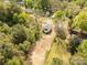 Aerial view of the house with surrounding trees, situated on a large, well-maintained lot at 119 Washington St, York, SC 29745