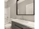 Bathroom features a vanity with a mirror, a sleek faucet, and a shower-tub combo at 119 Washington St, York, SC 29745
