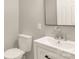 Bathroom shows a toilet and sink with mirror at 119 Washington St, York, SC 29745