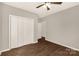 Bedroom showcases a closet, neutral paint, and durable flooring at 119 Washington St, York, SC 29745