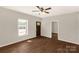 Light-filled bedroom featuring a ceiling fan, wood-look floors, and a window view at 119 Washington St, York, SC 29745