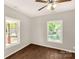 Comfortable bedroom with natural light, wood-look floors, and ceiling fan at 119 Washington St, York, SC 29745