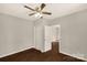 Bedroom with wood-look floors and open closet and doorway at 119 Washington St, York, SC 29745