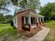 Brick-accented home with a covered porch, offering a blend of traditional charm and modern accents at 119 Washington St, York, SC 29745