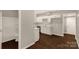Modern kitchen with white cabinets, stainless steel appliances, and adjacent bathroom at 119 Washington St, York, SC 29745