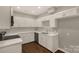 Bright kitchen with white cabinets, stone countertops, and stainless steel appliances at 119 Washington St, York, SC 29745