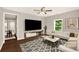 Bright living room featuring a large screen television, stylish furniture, and contemporary decor at 119 Washington St, York, SC 29745