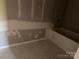 Bathroom with a bathtub that is surrounded by GoBoard at 122 39Th Avenue Nw Ct, Hickory, NC 28601