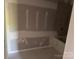 Bathroom with a bathtub that is surrounded by GoBoard at 122 39Th Avenue Nw Ct, Hickory, NC 28601