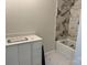 Bathroom with a new vanity, tiled floor, and a new shower at 122 39Th Avenue Nw Ct, Hickory, NC 28601