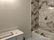 Bathroom featuring a new vanity, tile floor, and tub shower at 122 39Th Avenue Nw Ct, Hickory, NC 28601