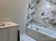 Bathroom features a tub and modern white vanity at 122 39Th Avenue Nw Ct, Hickory, NC 28601