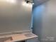 Bathroom vanity features a pink quartz countertop, undermount sinks, and modern lighting fixture at 122 39Th Avenue Nw Ct, Hickory, NC 28601