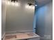 Bathroom featuring a new vanity with dual sinks and modern lighting at 122 39Th Avenue Nw Ct, Hickory, NC 28601