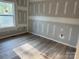 Bedroom featuring fresh drywall, wood flooring, and ample natural light at 122 39Th Avenue Nw Ct, Hickory, NC 28601