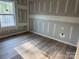 Bedroom featuring fresh drywall, wood flooring, and ample natural light at 122 39Th Avenue Nw Ct, Hickory, NC 28601