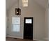 Entryway featuring black front door with glass inserts and a modern light fixture at 122 39Th Avenue Nw Ct, Hickory, NC 28601