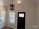 Welcoming entryway featuring a black front door with glass accents and a modern light fixture at 122 39Th Avenue Nw Ct, Hickory, NC 28601