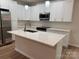 Bright kitchen featuring white cabinets, stainless steel appliances, and a center island with a white countertop at 122 39Th Avenue Nw Ct, Hickory, NC 28601
