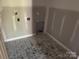This laundry room has stylish flooring and all the necessary hookups at 122 39Th Avenue Nw Ct, Hickory, NC 28601