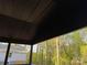 Overhead view of the covered patio, with backyard foliage in the background at 122 39Th Avenue Nw Ct, Hickory, NC 28601