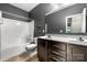 Well-lit bathroom with double sinks, shower, and sleek vanity offers a modern and functional space at 13012 Hunting Birds Ln, Charlotte, NC 28278