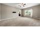 Large bedroom with neutral carpet, ceiling fan, and natural light from windows at 13012 Hunting Birds Ln, Charlotte, NC 28278