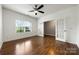Bright, spacious bedroom with hardwood floors and french doors leading to another room at 13012 Hunting Birds Ln, Charlotte, NC 28278