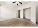 This bedroom features carpeted floors, a ceiling fan, and a closet at 13012 Hunting Birds Ln, Charlotte, NC 28278