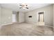 Bedroom featuring neutral carpet, ceiling fan, and television mount at 13012 Hunting Birds Ln, Charlotte, NC 28278