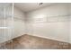 Large walk-in closet with shelving for storage and organization at 13012 Hunting Birds Ln, Charlotte, NC 28278