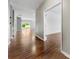 Spacious hallway with hardwood floors, connecting to the living area and bedrooms at 13012 Hunting Birds Ln, Charlotte, NC 28278