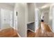 Hallway with work station and hardwood flooring at 13012 Hunting Birds Ln, Charlotte, NC 28278